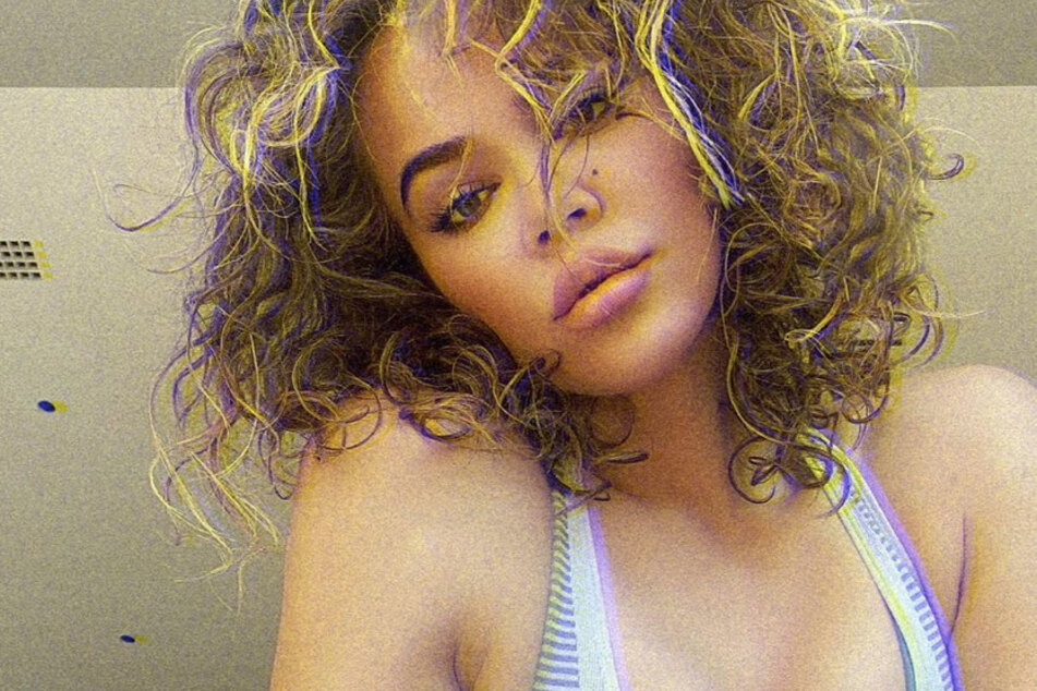 Khloé Kardashian let her curls loose last year in a sexy pic, where she sported a post-workout glow!