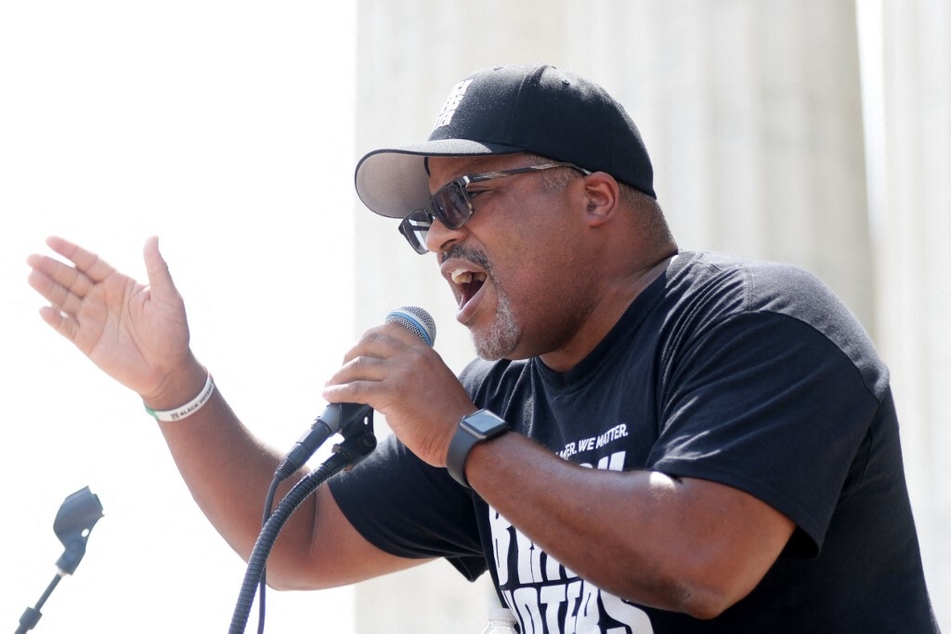 Black Voters Matter co-founder Cliff Albright speaks during a rally at the Lincoln Memorial in Washington DC.