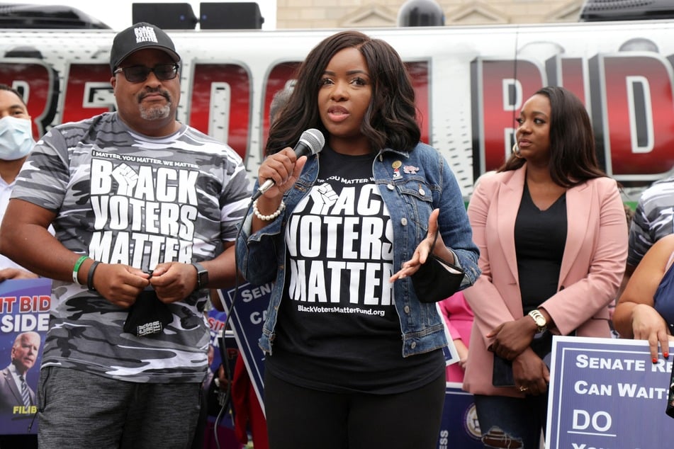 Congresswoman Jasmine Crockett (c.) speaking during a demonstration on voting rights outside the National Museum of African American History and Culture on August 4, 2021.