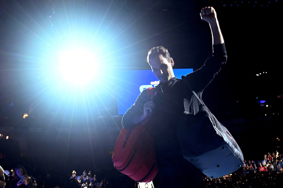 Roger Federer celebrates after winning a match at the ATP Finals in 2019.