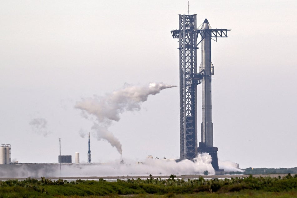 A SpaceX Super Heavy booster carrying the Starship spacecraft vents before the launch is scrubbed at the company's launch complex in Texas on August 24, 2025.