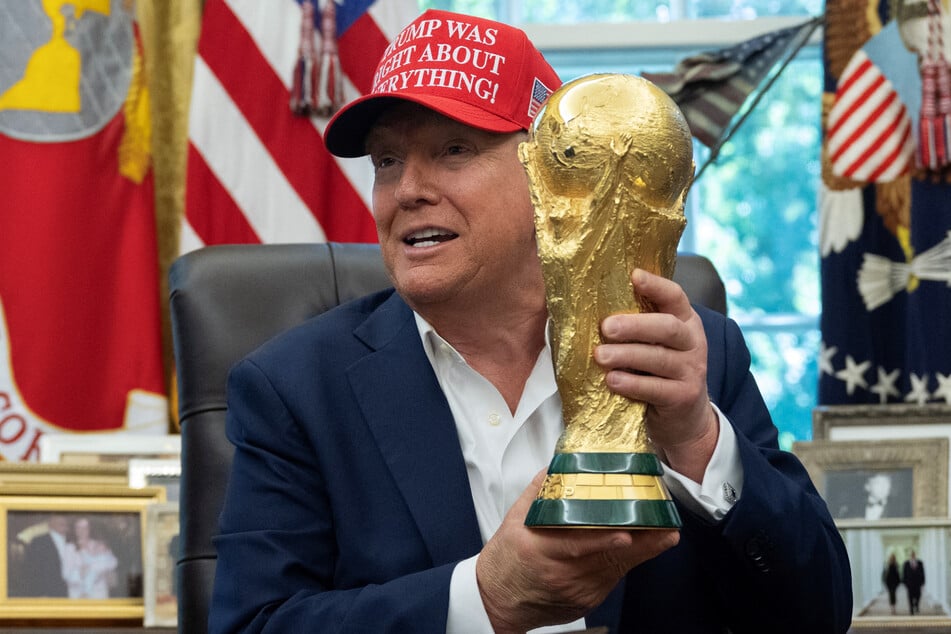 Trump proudly displayed the 2026 World Cup trophy in the Oval Office on Friday.