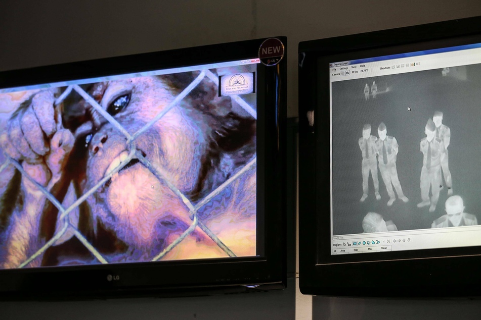 Body temperatures being checked at an airport in Singapore after a case of monkeypox was detected there in 2019.