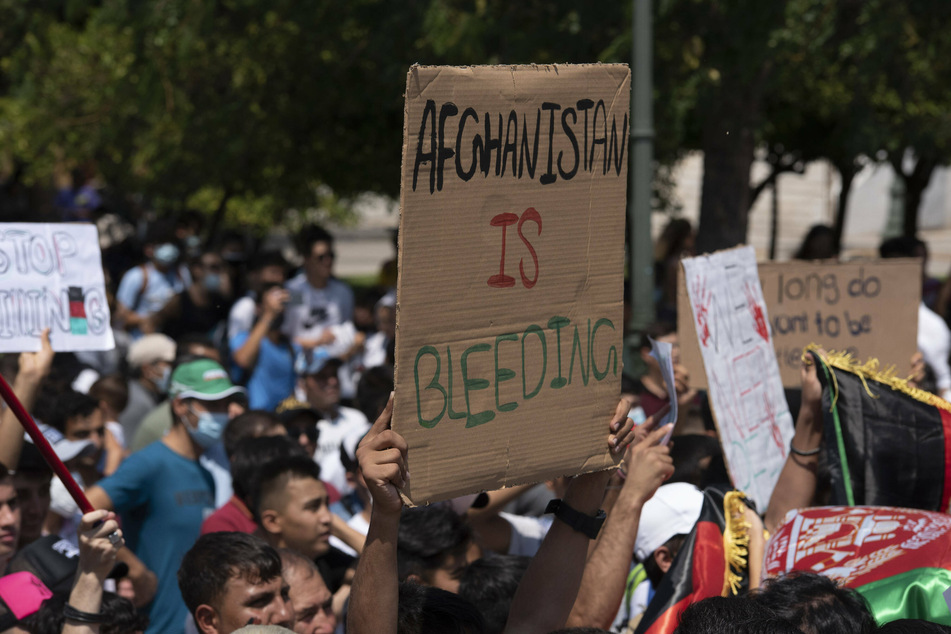 Afghan refugees outside the country have protested the recent Taliban takeover and urged for world rescue efforts.