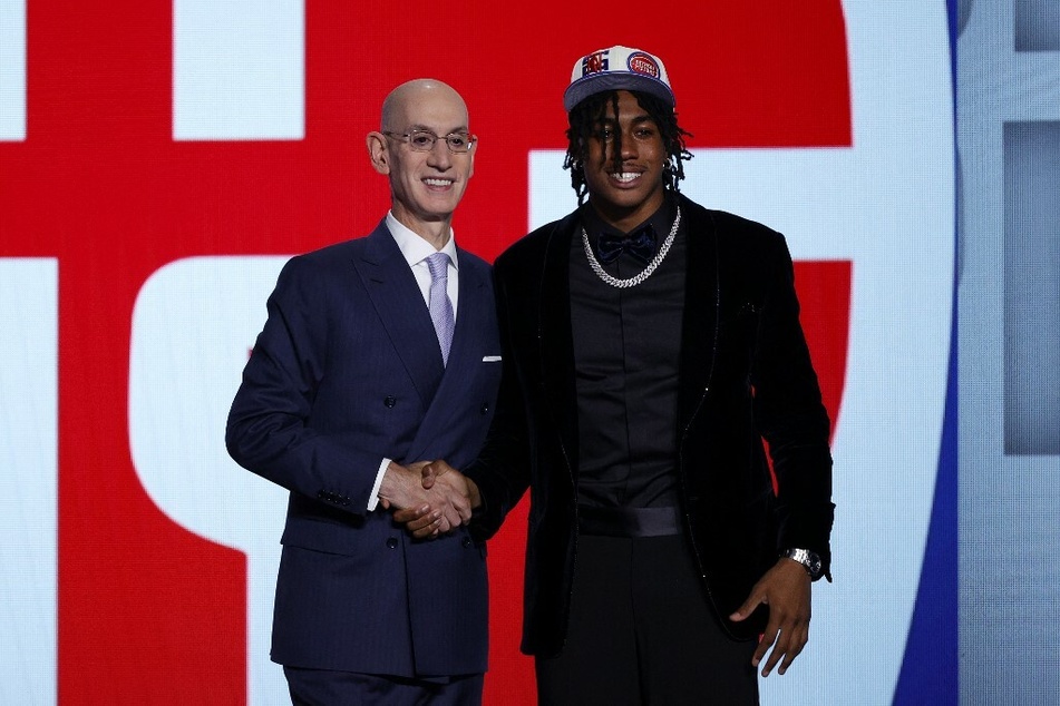NBA commissioner Adam Silver (l.) and Jaden Ivey.