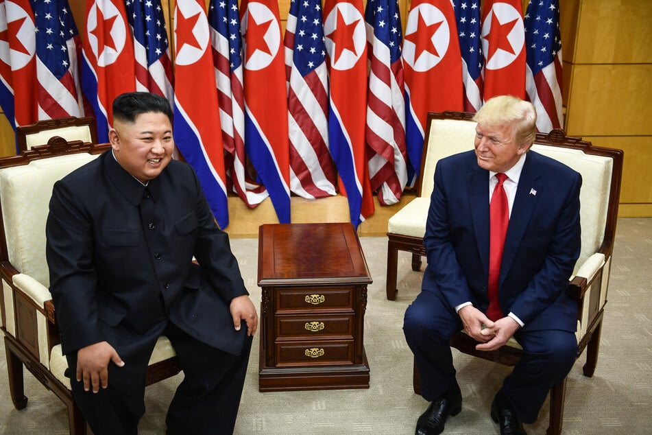 North Korea's leader Kim Jong Un (l.) and US President Donald Trump attend a meeting on the south side of the Military Demarcation Line that divides North and South Korea on June 30, 2019.