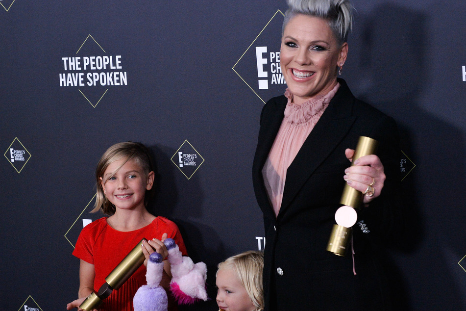 Singer Pink (r) is known for her edgy, rebellious lyrics. She seems to bring that same energy to her family life.