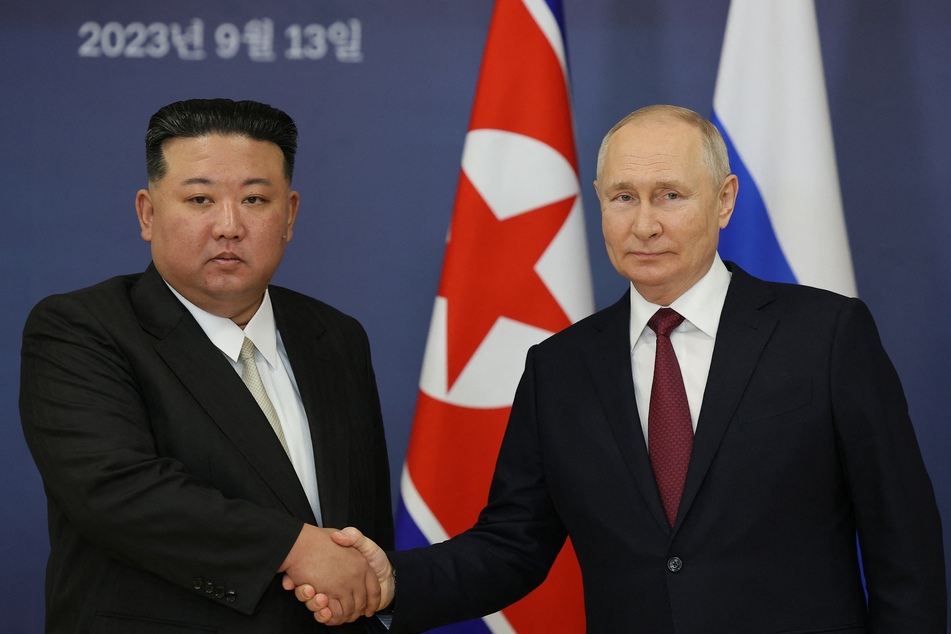 Russian President Vladimir Putin (r.) and North Korea's leader Kim Jong Un (l.) shake hands during their meeting on September 13, 2023.
