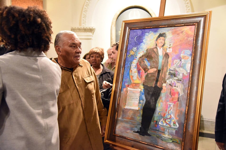 Lawrence Lacks, the oldest son of Henrietta Lacks, looks at a portrait of his mother during an unveiling in the Baltimore City Hall rotunda on August 5, 2024.
