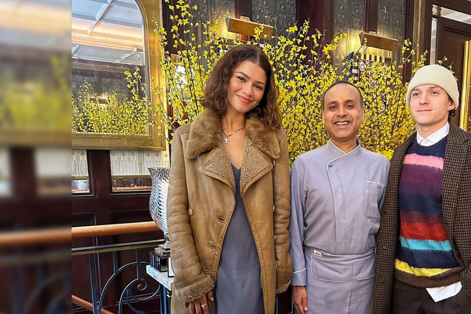 Zendaya and Tom Holland (r) posed with Executive Chef Surender Mohan (c) at Jamavar in London.