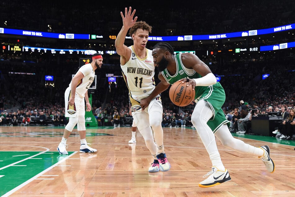 Boston Celtics guard Jaylen Brown controls the ball while New Orleans Pelicans guard Dyson Daniels defends during the second half at TD Garden.