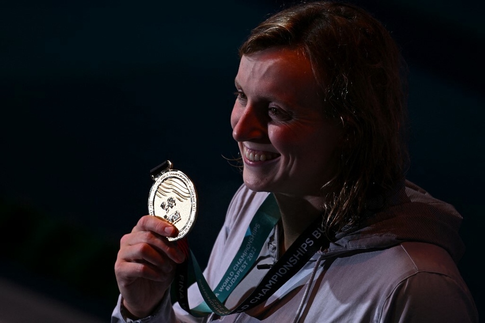 Team USA's Katie Ledecky poses with her 19th gold medal following the women's 800m freestyle finals during the Budapest 2022 World Aquatics Championships.