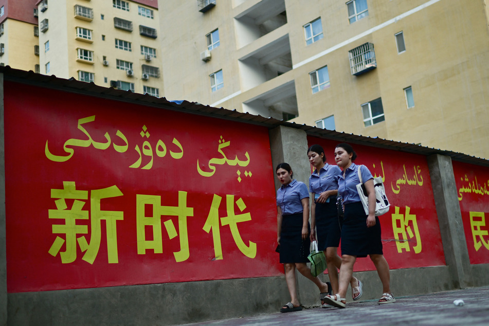 In Xinjiang, propaganda signs promote the idea of ethnic unity.