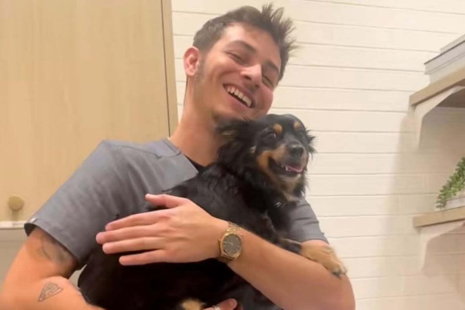Medical assistant Rubén Colón and smitten dog Journie are a great team.