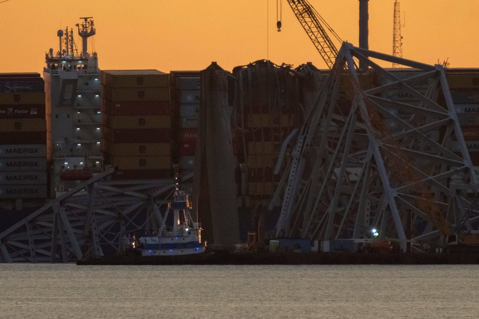 Cranes arrived at the scene of the collapsed Francis Scott Key Bridge in Baltimore to begin the clean-up phase of the operation.