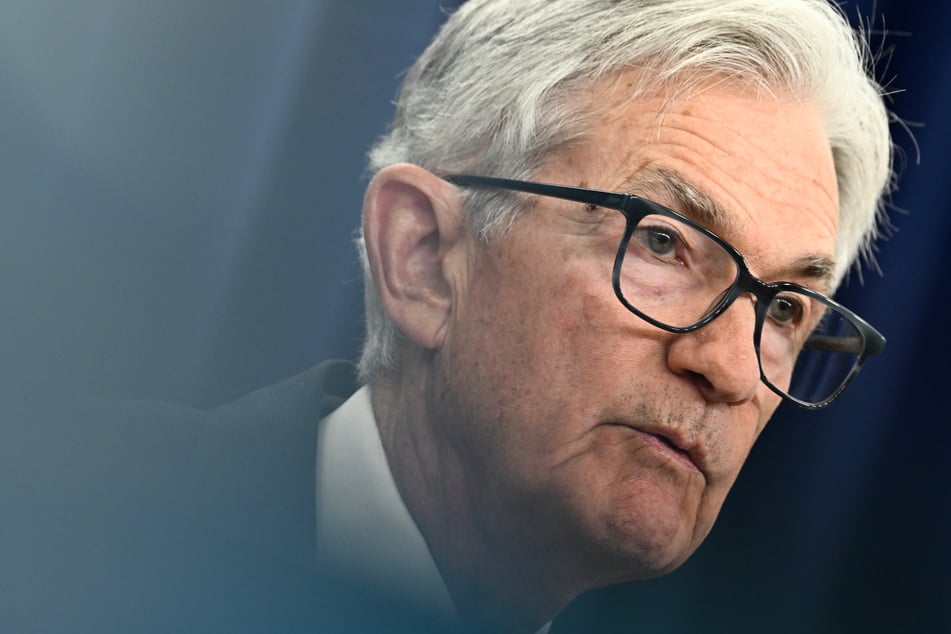 Powell urges Fed independence as he reveals plan to stay on at central bank