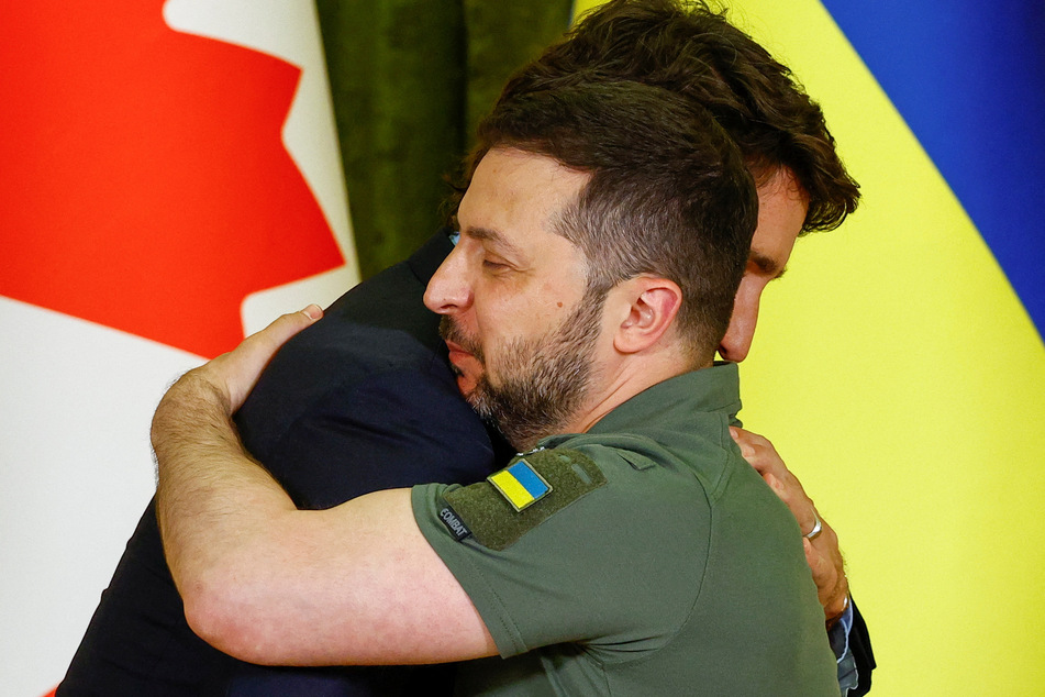 Canadian Prime Minister Justin Trudeau and Ukrainian President Volodymyr Zelensky embrace at a joint press conference in Kyiv.