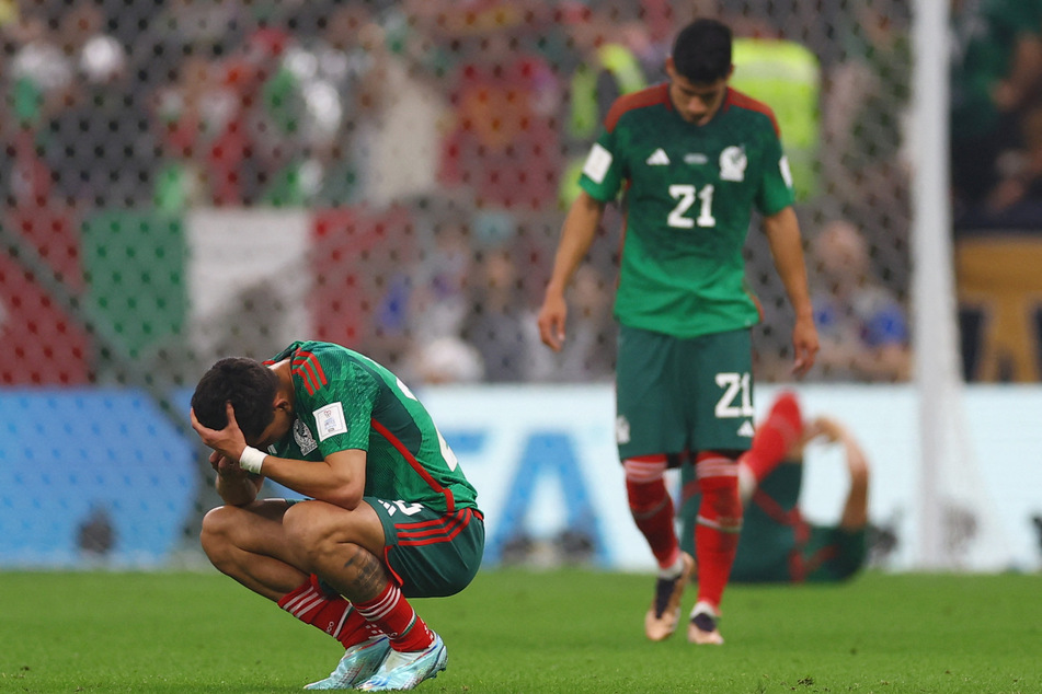 Mexican players look dejected at the end of their 2-1 win over Saudi Arabia, which wasn't enough for qualification.