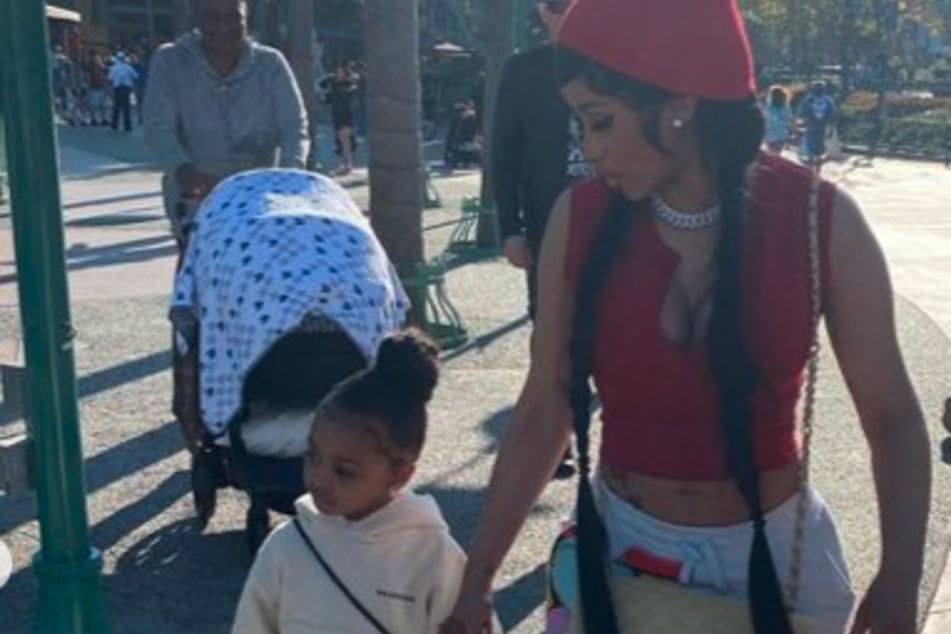 Cardi B takes her daughter Kulture Kiari for a stroll in the park.