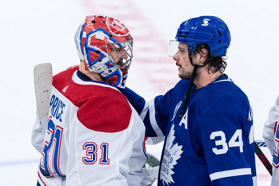 Leafs Center Auston Matthews (r) and Canadiens Goalie Carey Price (l) shake hands to close out game seven