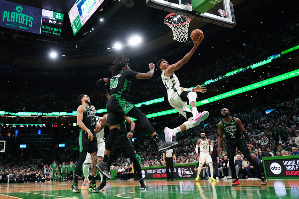 Giannis Antetokounmpo goes up to score against the Celtics during the Bucks' win in Boston.