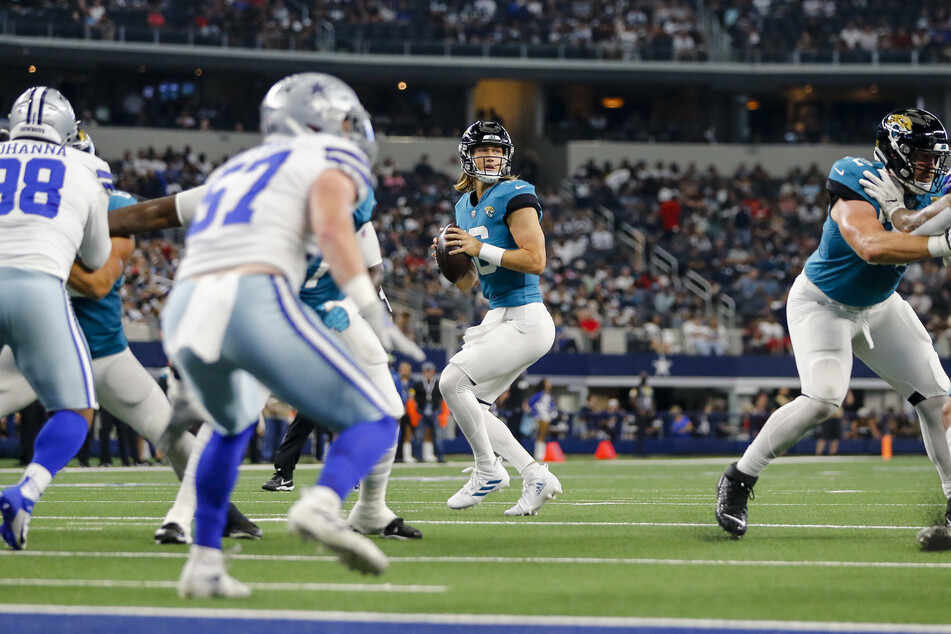 Jaguars quarterback Trevor Lawrence (c) threw two touchdowns in his team's preseason win over the Cowboys on Sunday.