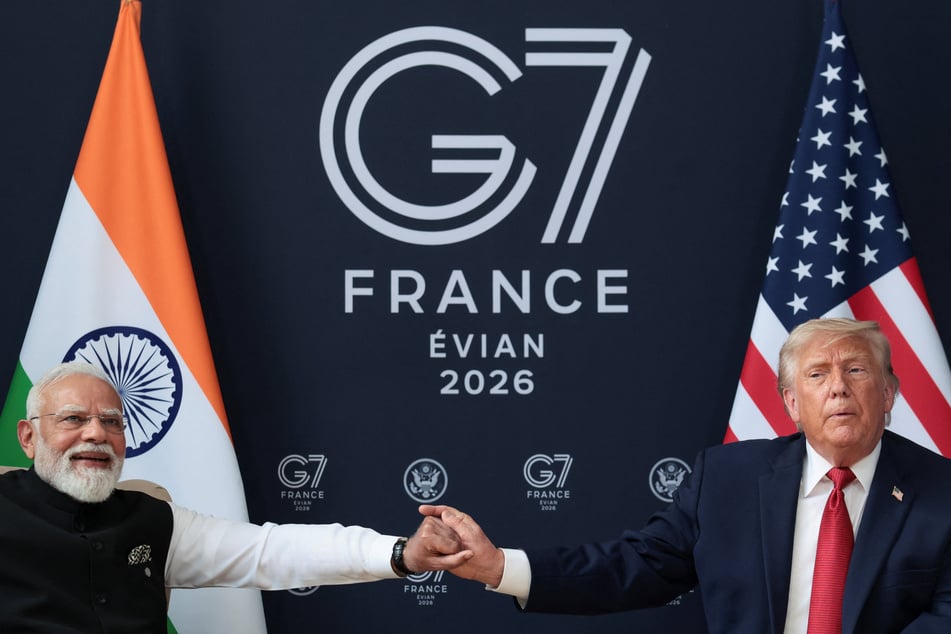 President Donald Trump (r.) holds Indian Prime Minister Narendra Modi's hand as they attend a bilateral meeting during the G7 Summit in Evian-les-Bains, France, on June 17, 2026.
