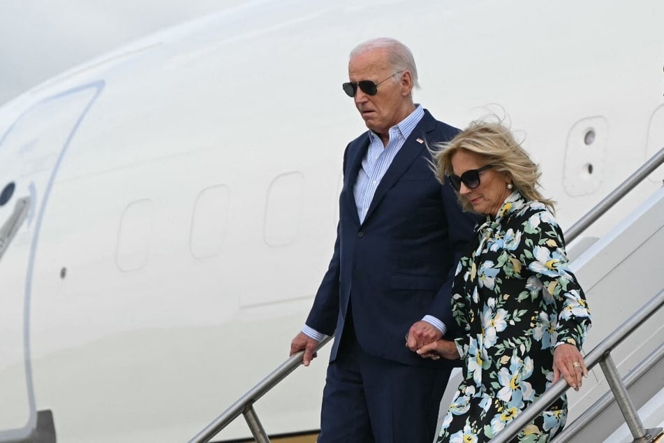 President Joe Biden and First Lady Jill Biden step off Air Force One upon arrival at McGuire Air Force Base in New Jersey to attend campaign fundraisers.