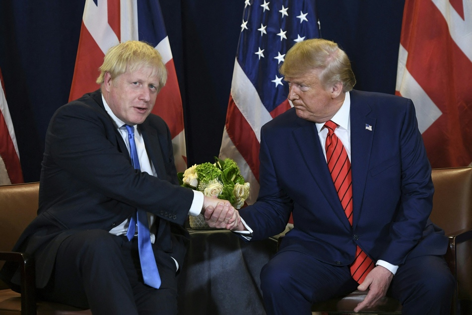 Former British PM Boris Johnson (l.) said the re-election of Donald Trump could be "just what the world needs."