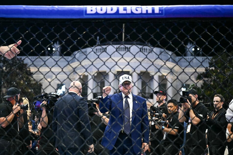 President Donald Trump stands in The Octagon at the conclusion of the "UFC Freedom 250" mixed martial arts event on the South Lawn of the White House in the early morning hours of June 15, 2026.