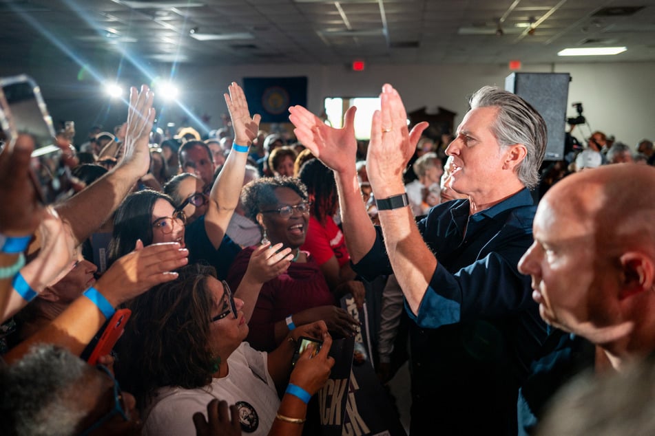 California Governor Gavin Newsom greets the crowd at the conclusion of a rally in Houston, Texas, on November 8, 2025.