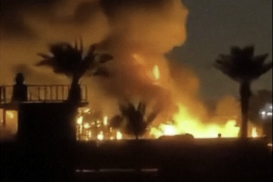 Fire and smoke plumes rise from a US diplomatic facility in Iraq near Baghdad airport in this screengrab obtained from a social media video released on March 20, 2026.