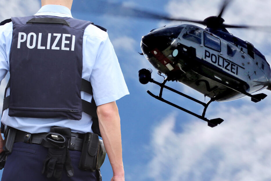 Die Polizei sucht am Boden und aus der Luft nach den mutmaßlichen Räubern (Symbolbild).