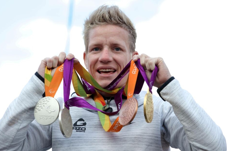 Marieke Vervoort mit ihren Olympischen Medaillen.