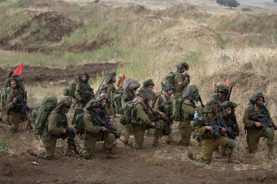 Israeli soldiers of the Jewish Ultra-Orthodox battalion "Netzah Yehuda" take part in their annual unit training in the Israeli-annexed Golan Heights, near the Syrian border, on May 19, 2014.