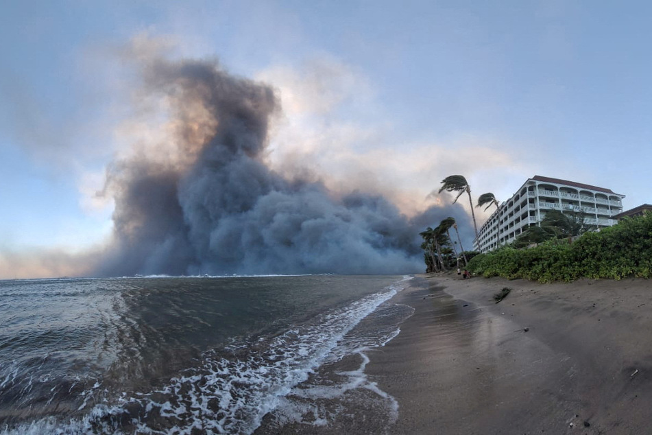 Residents fled the rapidly spreading flames, with many jumping in the ocean to survive.