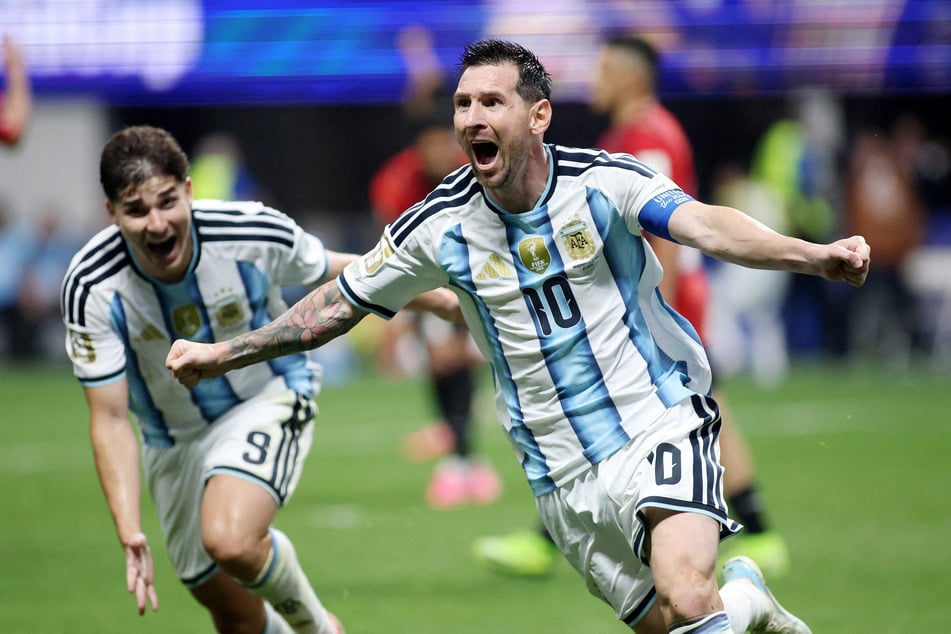 Argentina's Lionel Messi celebrates scoring their second goal against Egypt with Julian Alvarez.