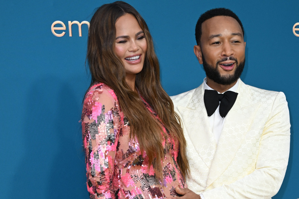 John Legend and Chrissy Teigen welcome new baby with surprise concert reveal
