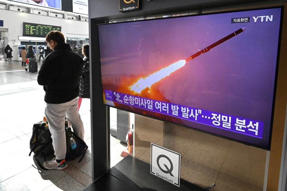 A broadast in Seoul showed file footage of a North Korean missile test after Pyongyang reportedly fired multiple cruise missiles in a new streak of weapons testing.