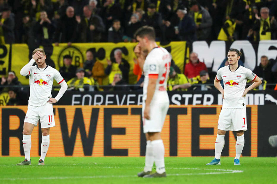 Timo Werner, Diego Demme und Marcel Sabitzer (v.l.n.r.) waren nach dem 0:1 durch Julian Weigl niedergeschlagen.