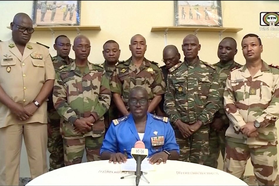 Niger Army spokesperson Colonel Major Amadou Adramane speaks during an appearance on national television, after President Mohamed Bazoum was held in the presidential palace, in Niamey, Niger, on July 26, 2023.