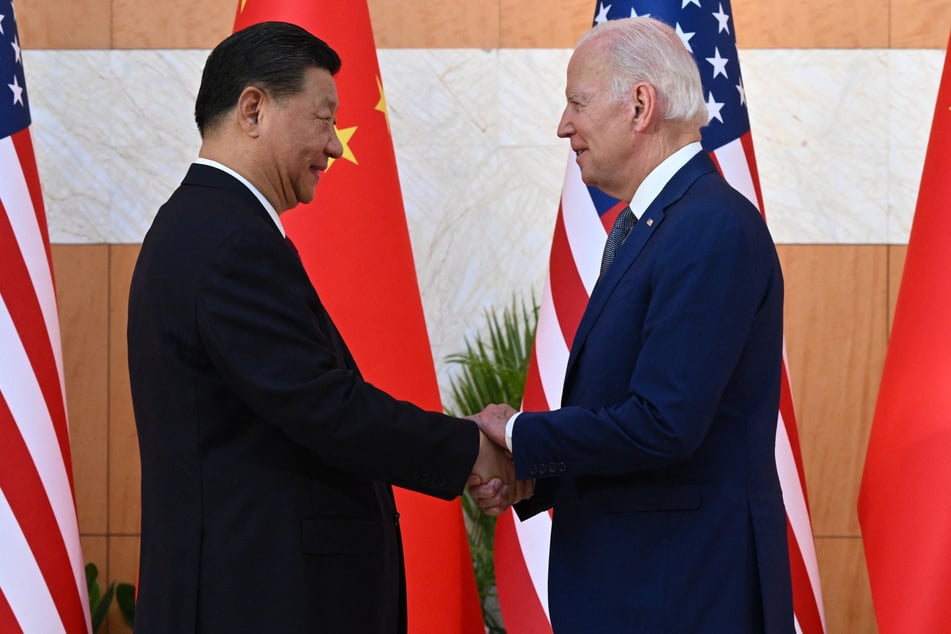 President Joe Biden (r.) and China's President Xi Jinping shake hands as they meet on the sidelines of the G20 Summit in Bali on November 14, 2022.