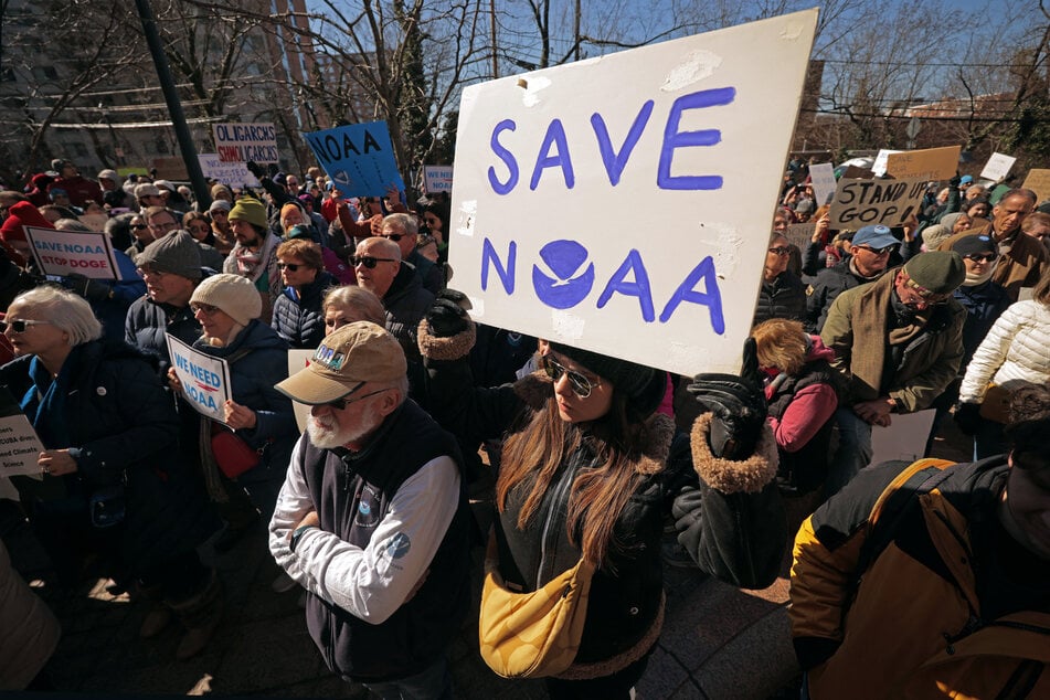 Hundreds of demonstrators gather to protest against Department of Government Efficiency (DOGE) cuts outside the headquarters of the National Oceanic and Atmospheric Administration on Monday in Silver Spring, Maryland. Last week the Trump administration fired about 800 probationary staff at NOAA, one of the world’s premier centers for climate science.