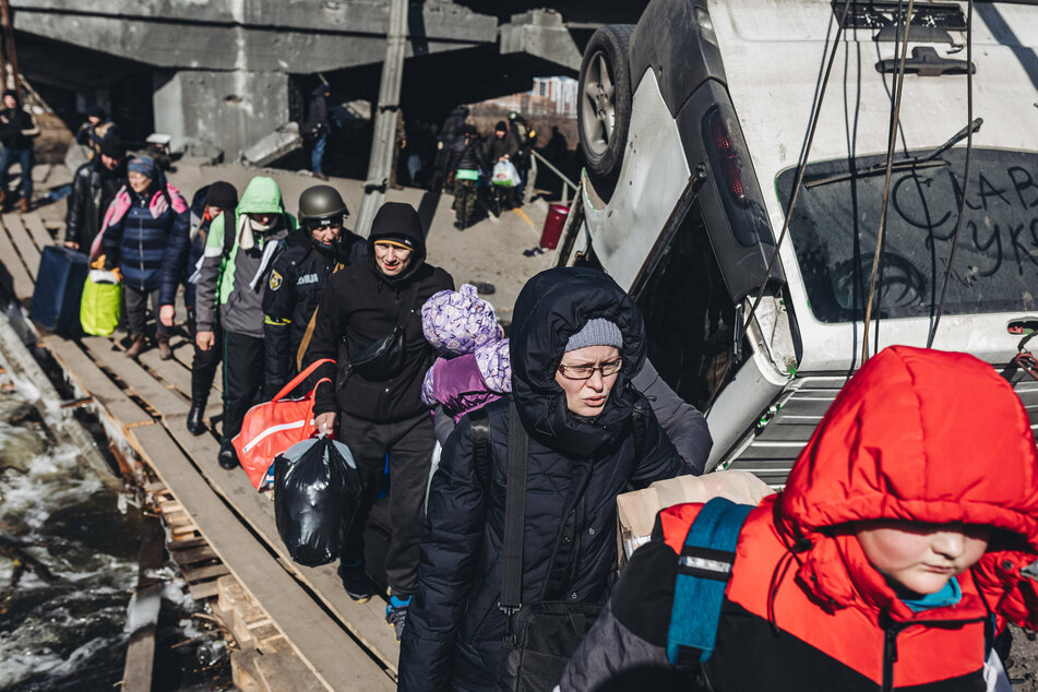 Civilians being evacuated in Irpin, a village near Kyiv.