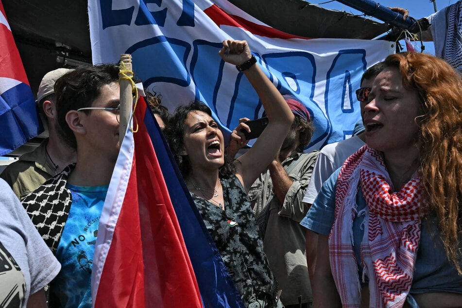 Nuestra América Convoy activists chant onboard the Mexican boat nicknamed Grandma 2 as it sets sail to Cuba from Puerto Progreso, Mexico, on March 20, 2026.
