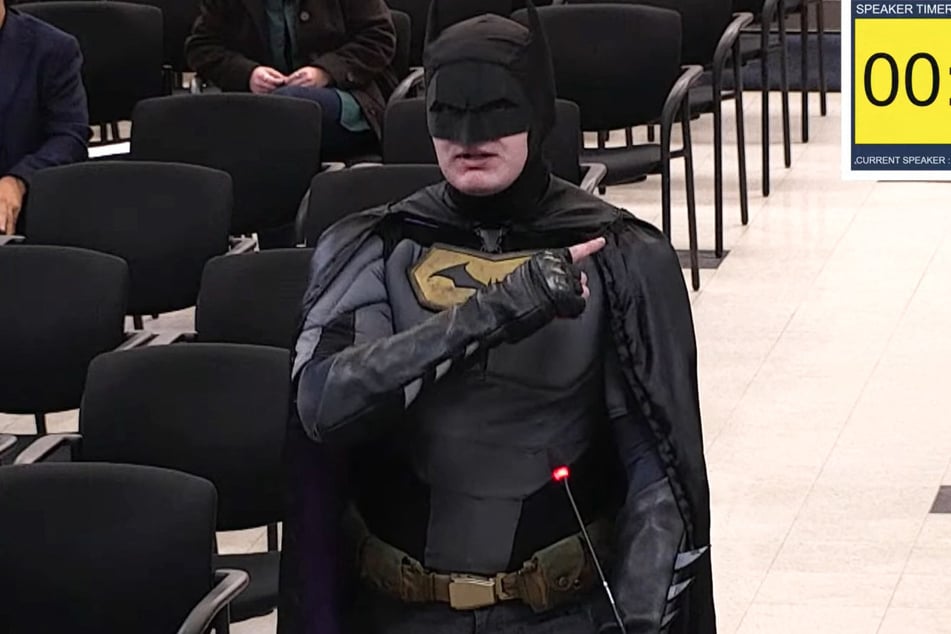 A man dressed as Batman berated officials in Santa Clara over claims they could let ICE officers patrol the Super Bowl.