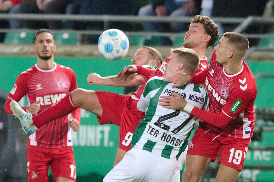 Mehr Kampf als Finesse: Trotzdem erzwang Köln in Hälfte Zwei mit einem Kopfball von Tim Lemperle (r.) den 1:0 Siegtreffer.