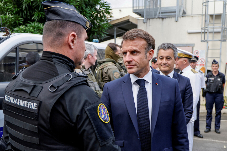French President Emmanuel Macron visits the central police station in Noumea, New Caledonia.