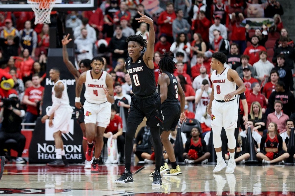 Terquavion Smith celebrates a win against the Louisville Cardinals.