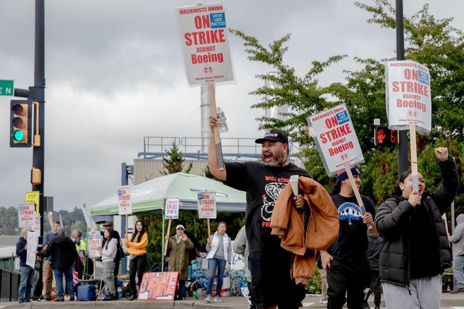 Striking Boeing workers and their supporters picket outside the Boeing Co. manufacturing facility in Renton, Washington, on Monday.